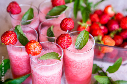 Strawberry smoothie with fresh berries with meant