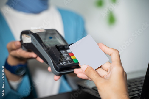 cashless payment by credit card to EDC machines in clothing stores