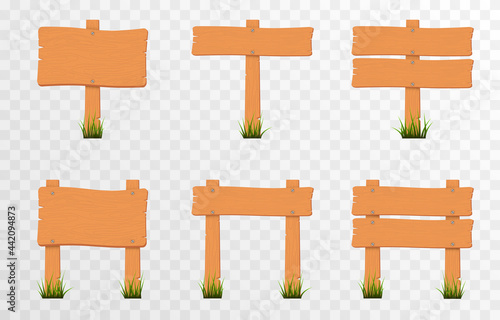 Set of cartoon wooden pointers, signs on green grass. Wooden pointers, plaques on an isolated transparent background. PNG.