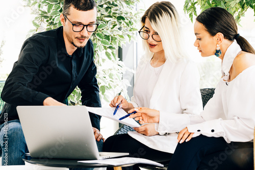 Young business colleagues working togheder  at the office photo