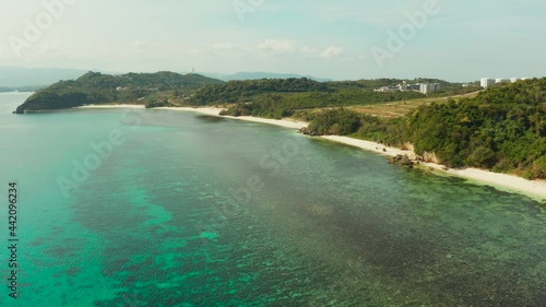 aerial drone: Sandy beach and turquoise water in the tropical resort of Boracay, Philippines, Ilig Iligan Beach. Summer and travel vacation concept. photo