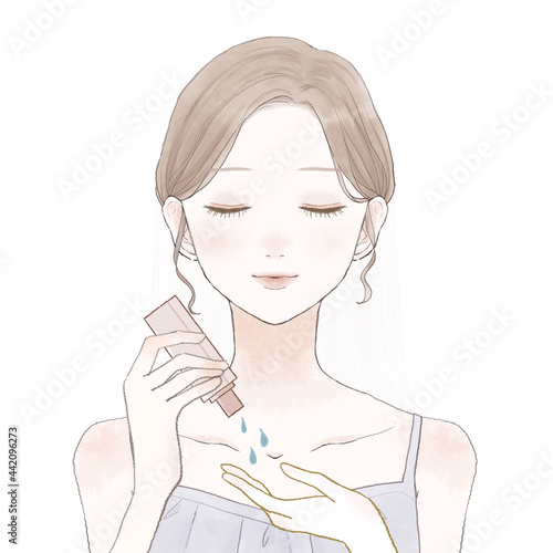 スキンケア用オイルを手に取る女性
