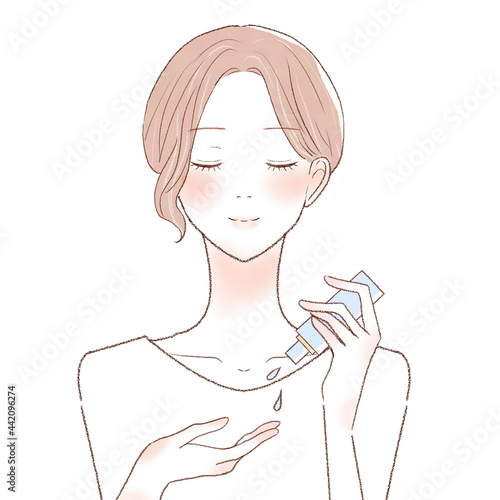 スキンケア用オイルを手に取る女性