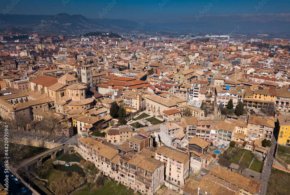 Views of houses and nature of ancient city Vic in Catalonia from high..