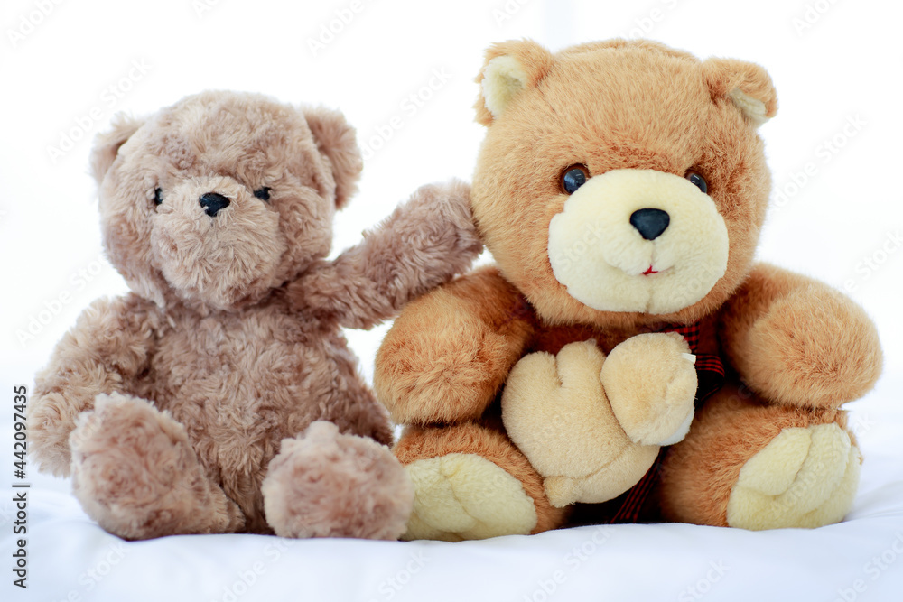 Romantic and delight atmosphere in bedroom set by concept of two brown lovely fluffy teddy bear toys creatively placed nearby as sweet friend acting funny play