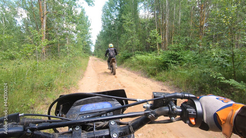 View from the enduro sports bike to the steering wheel and off-road track