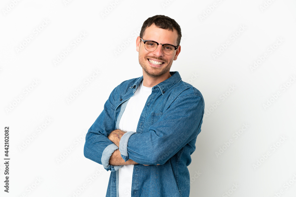 Brazilian man over isolated white background with arms crossed and looking forward Brazilian man over isolated white background with arms crossed and looking forward