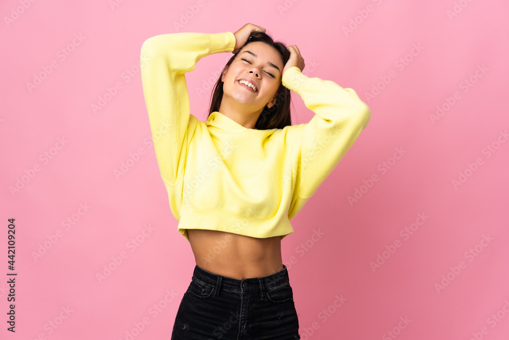 Teenager girl isolated on pink background laughing Teenager girl isolated on pink background laughing