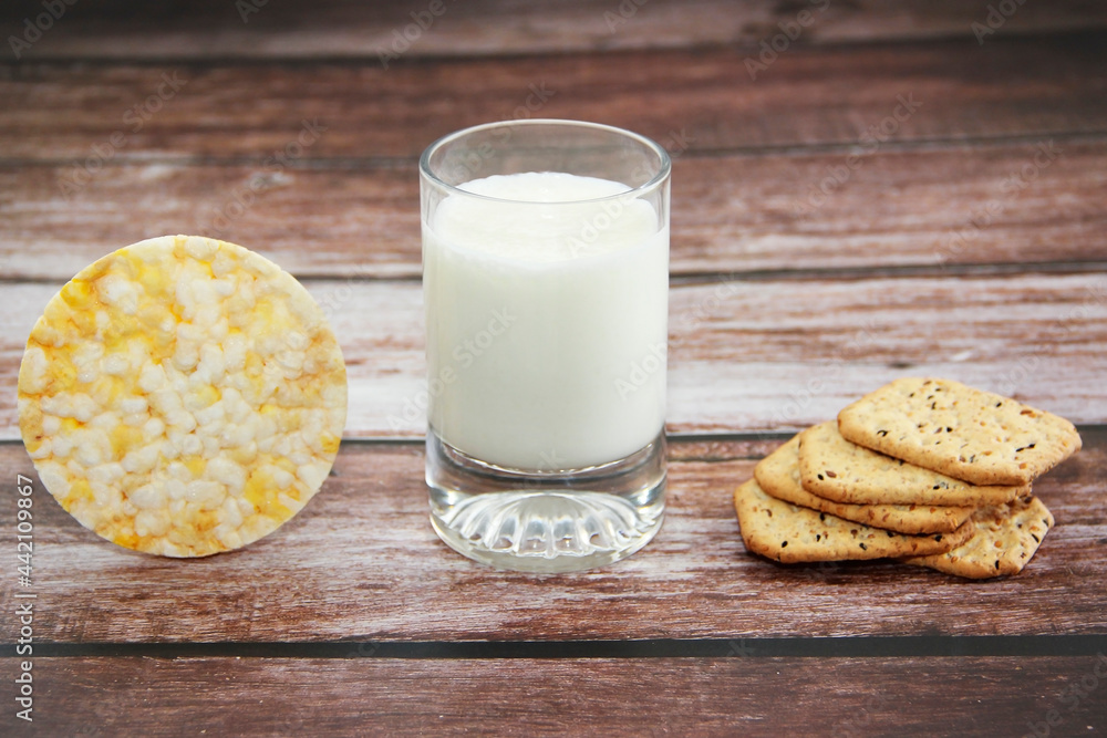 white kefir in a glass and crunchy diet crackers white kefir in a glass and crunchy diet crackers