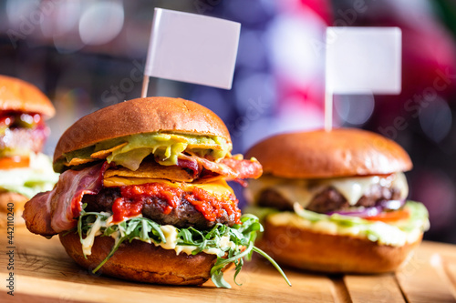 Фотография Burgers in american restaurant with empty toothpick flags