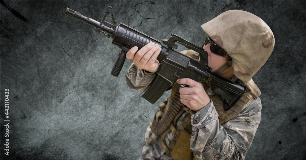 Composition of male soldier wearing sunglasses pointing gun, against smoke on black Composition of male soldier wearing sunglasses pointing gun, against smoke on black