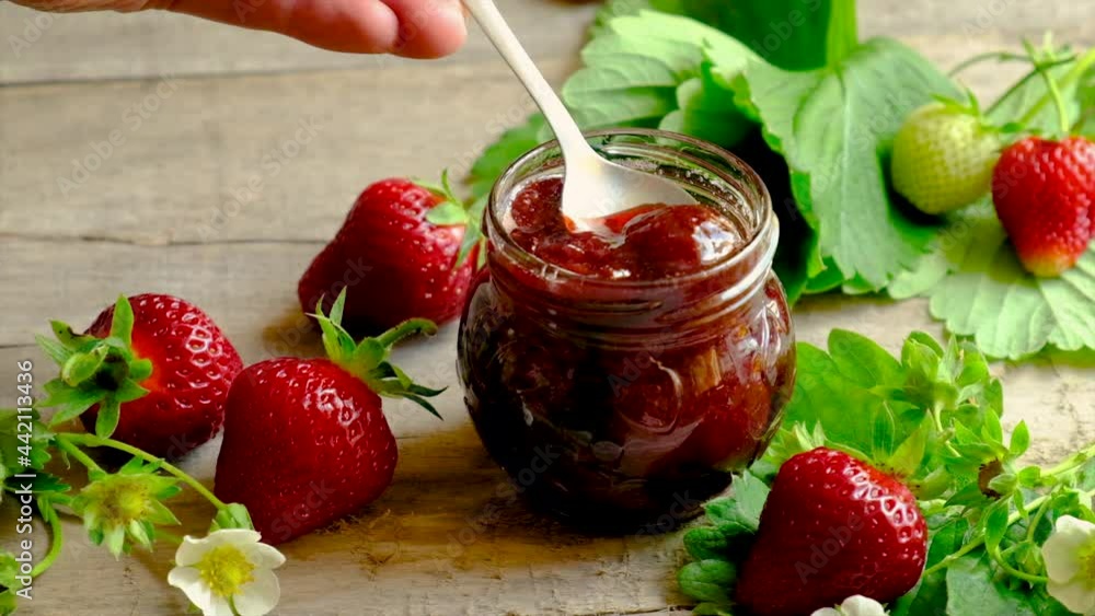 Strawberry jam in a jar. Selective focus. Strawberry jam in a jar. Selective focus.