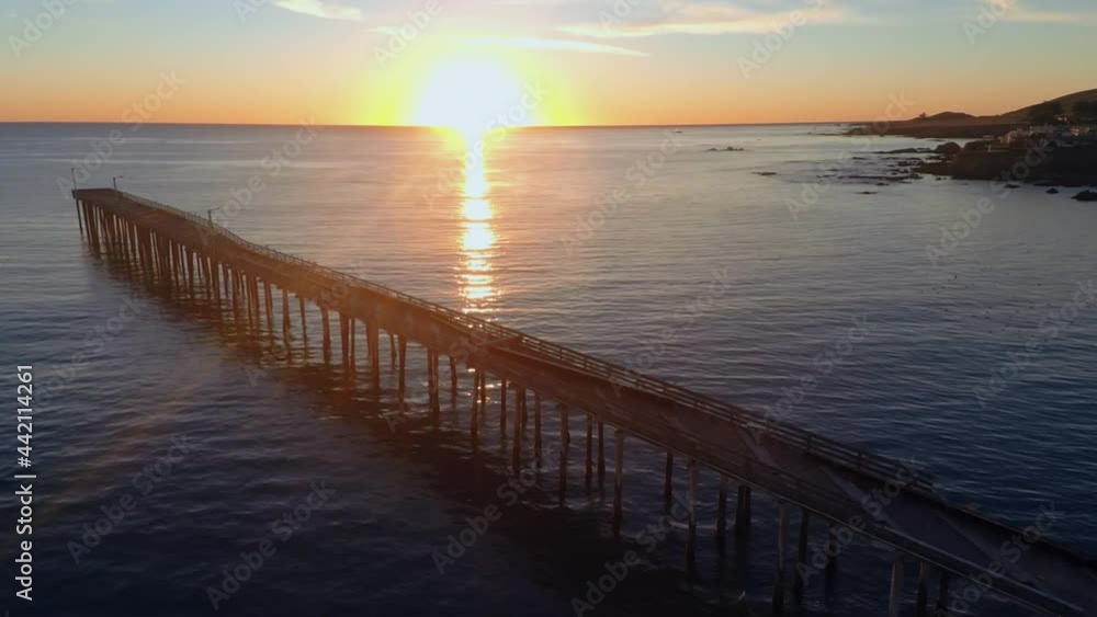 Aerial: Calm water at sunset at the beach. Pismo Beach Aerial: Calm water at sunset at the beach. Pismo Beach