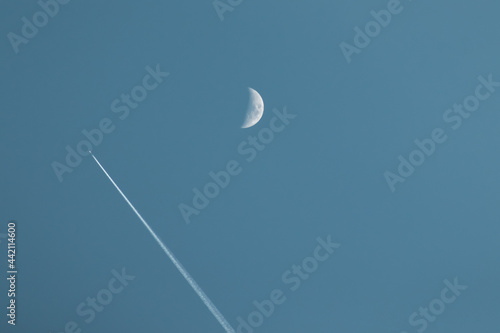 The Moon and a plane. photo