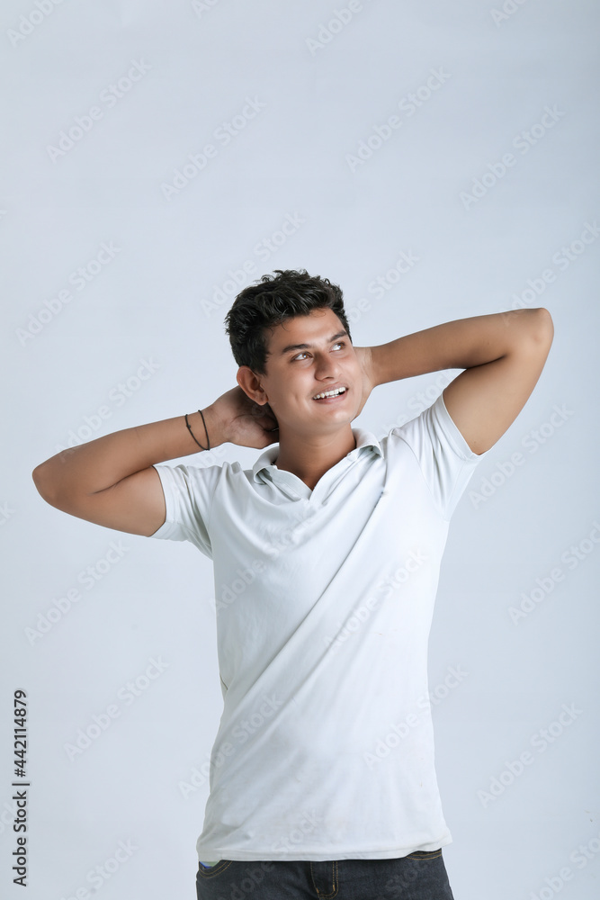 Young indian college student showing expression on white background Young indian college student showing expression on white background