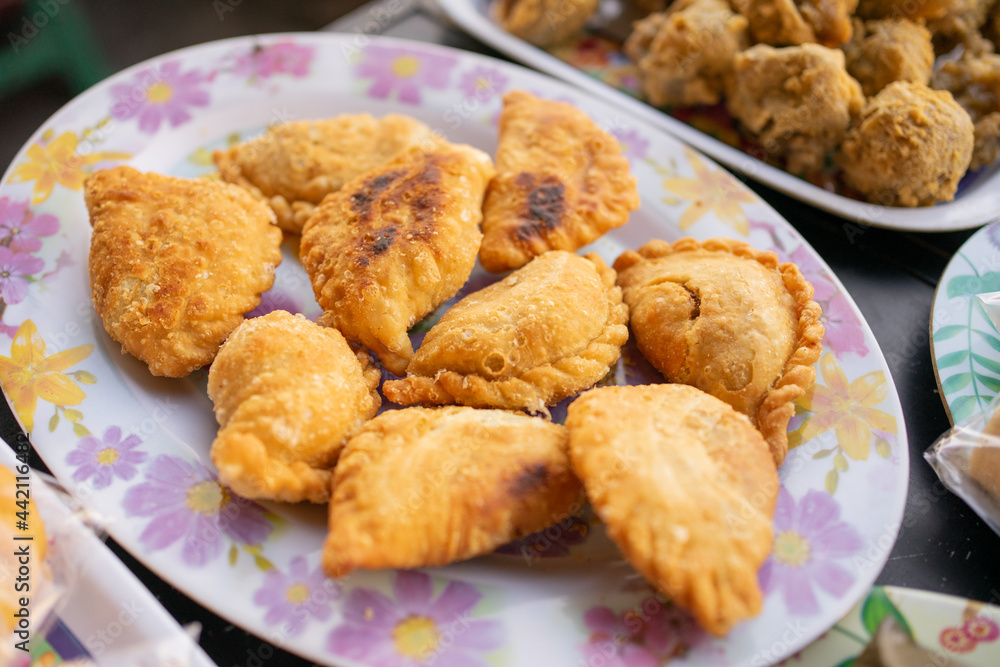 various kinds of traditional Indonesian street food, pastel served on a serving plate on the table