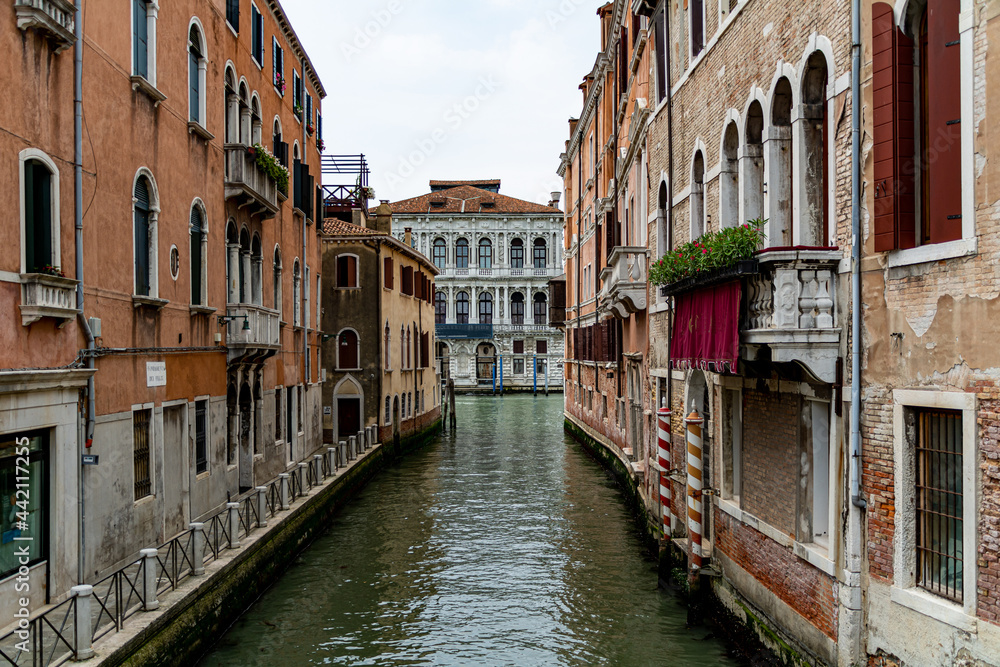 A Water Canal (so-called Riva) in Venice, Italy. These waterways are the main means of transport in the city