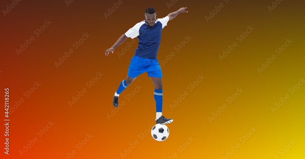 Composition of male football player kicking football with copy space