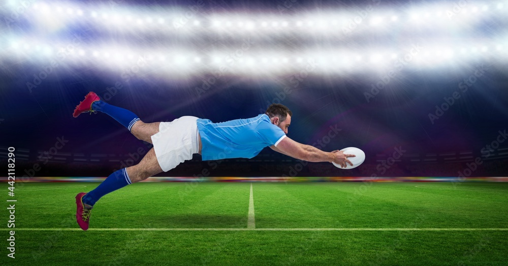 Composition of male rugby player holding rugby ball at stadium