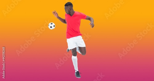 Composition of male football player catching football with copy space © vectorfusionart
