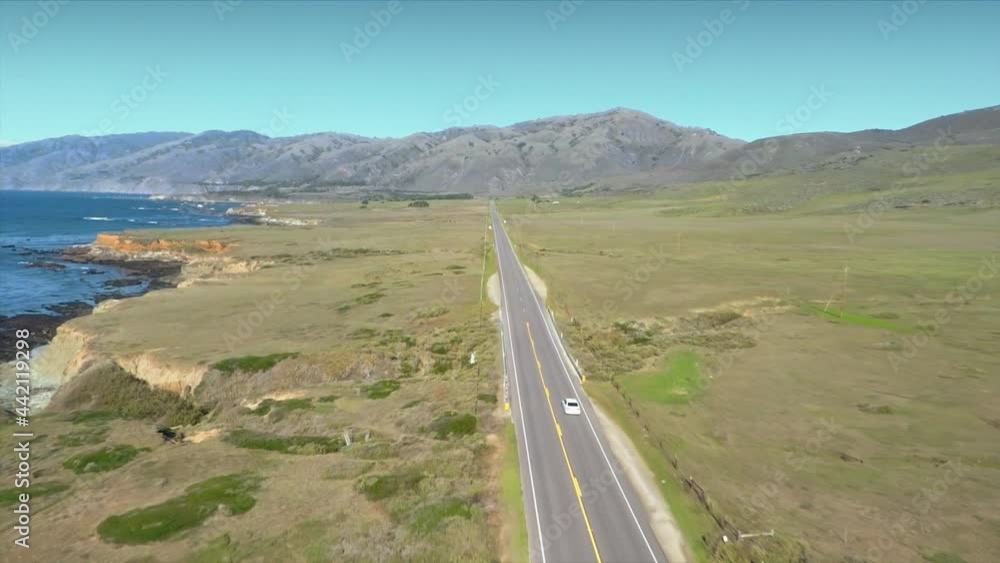 Aerial: Car driving down coast country road in Big Sur, California Aerial: Car driving down coast country road in Big Sur, California