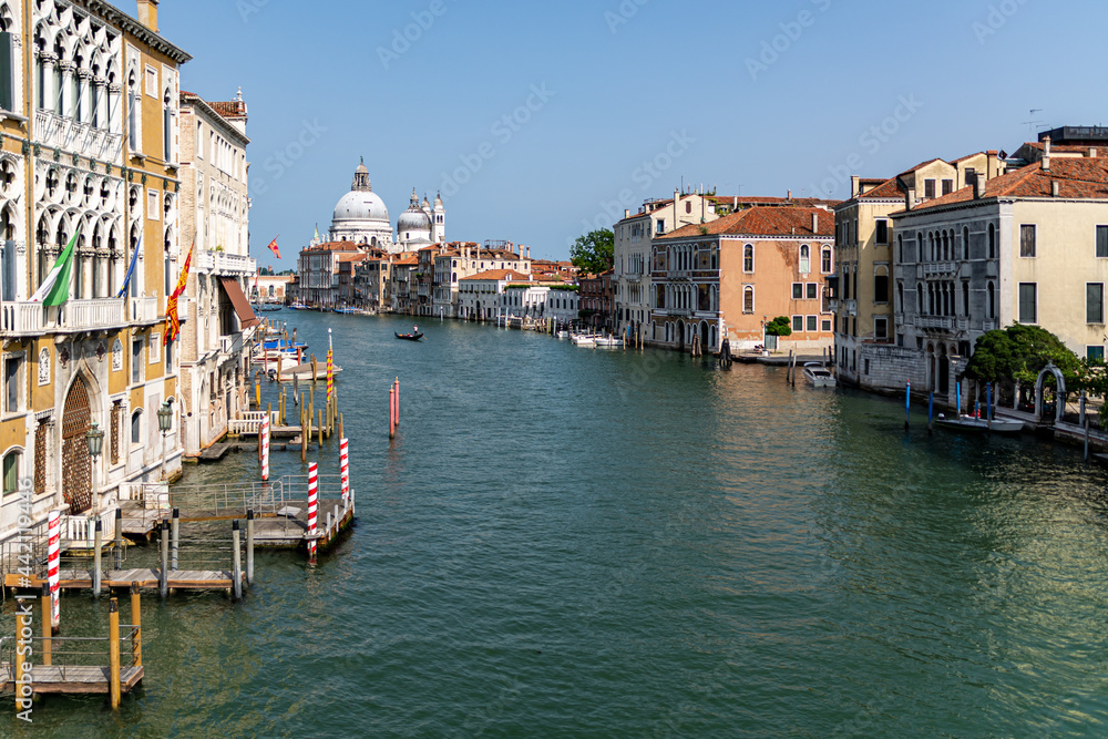 View of the Grand Canal with close up of Santa Maria della Salute, famous Roman Catholic cathedral, seen from Ponte Dell'Accademia