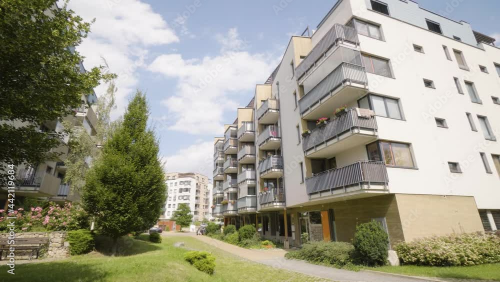 An apartment building in a suburban apartment complex with greenery