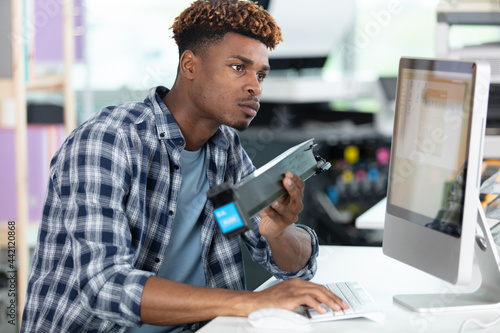 male technician using a desktop computer