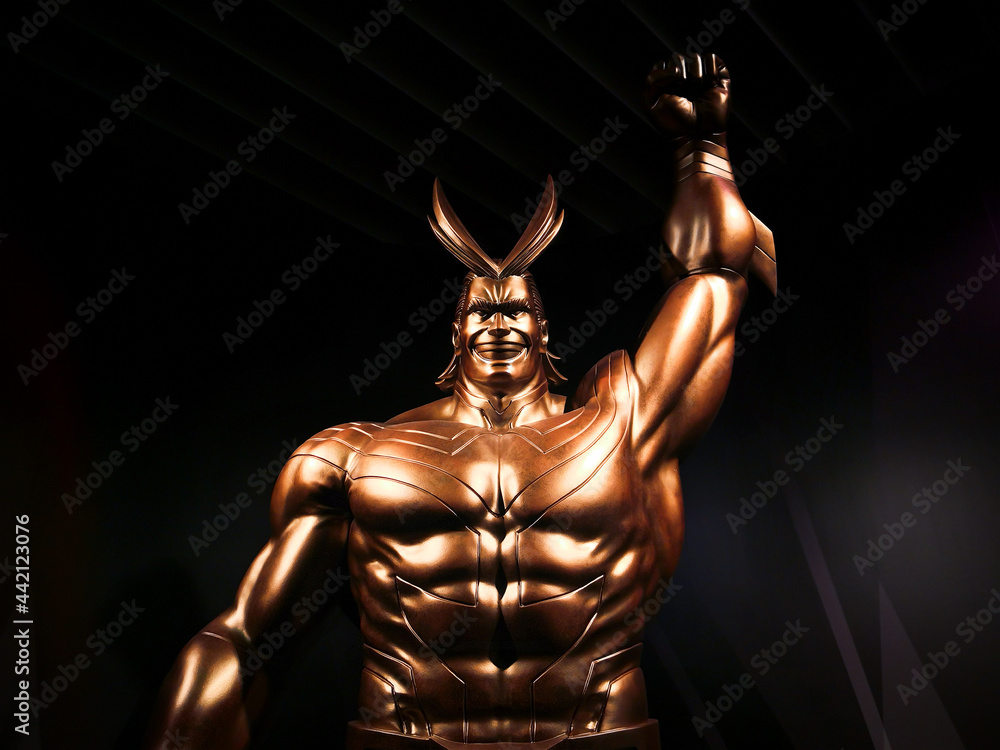 tokyo, japan june 03 2021 Close up on the golden sculpture of the superhero All Might raising