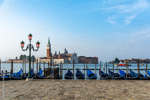 Gondolas mored in front of St. Mark's Square with San Giorgio di Maggiore church in the background Venice, Italy