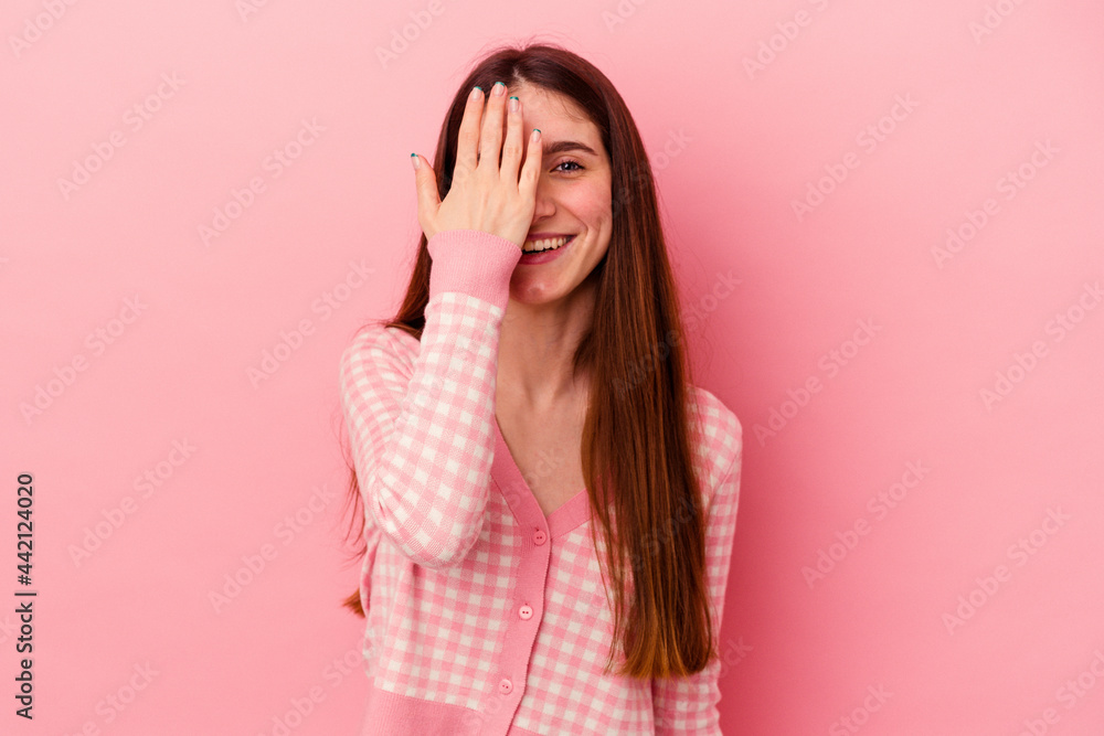 having fun covering half of face with palm. having fun covering half of face with palm.