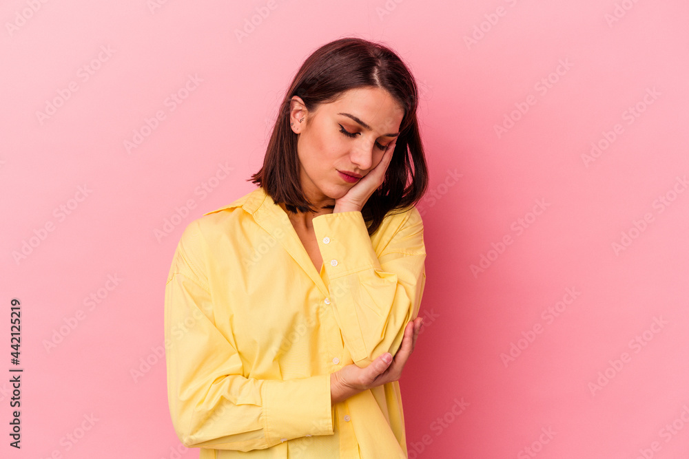 Young caucasian woman isolated on pink background who is bored, fatigued and need a relax day. Young caucasian woman isolated on pink background who is bored, fatigued and need a relax day.