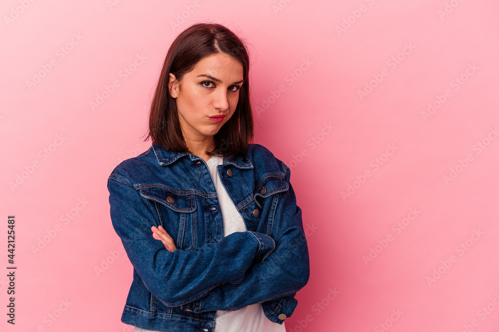 Young caucasian woman isolated on pink background who is bored, fatigued and need a relax day. Young caucasian woman isolated on pink background who is bored, fatigued and need a relax day.