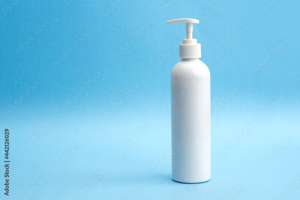A bottle of sanitizing gel or liquid for washing hands. Cleanliness and body care concept. A bottle of sanitizing gel or liquid for washing hands. Cleanliness and body care concept.