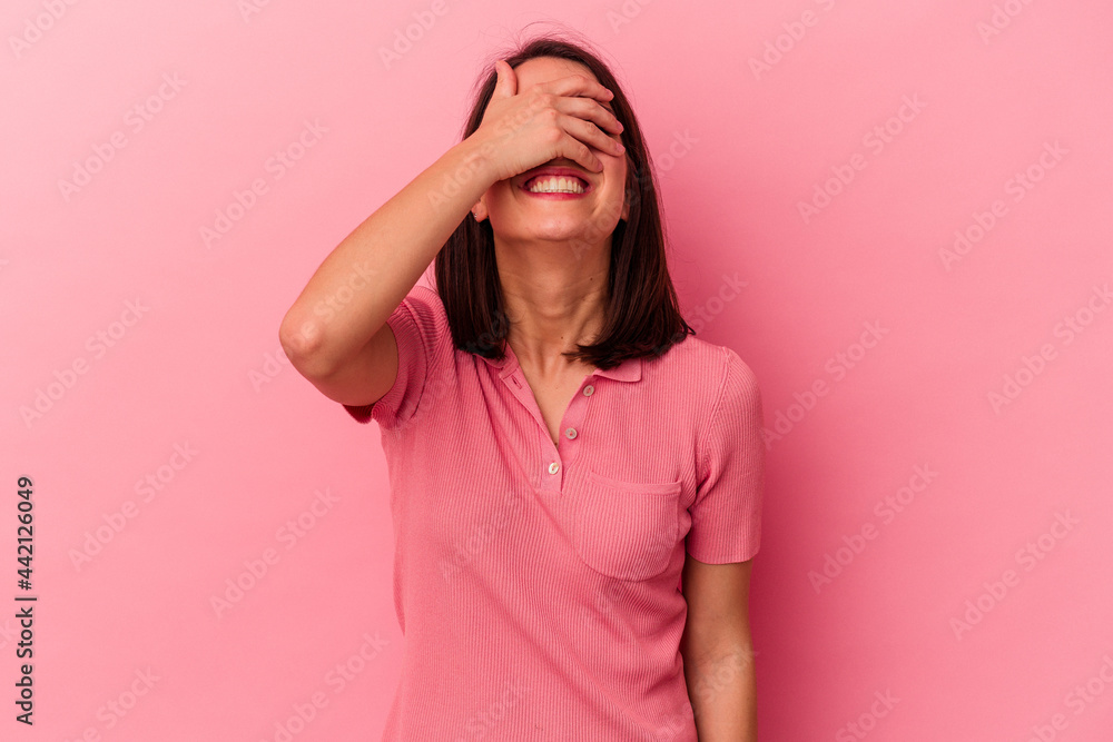 Young caucasian woman isolated on pink background covers eyes with hands, smiles broadly waiting for a surprise. Young caucasian woman isolated on pink background covers eyes with hands, smiles broadly waiting for a surprise.