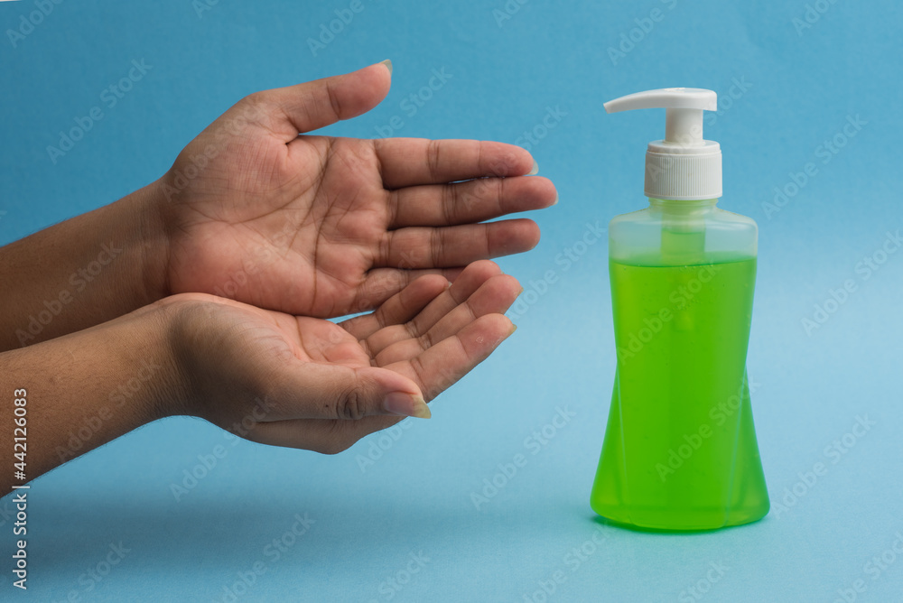 Closeup of person washing hands or using a sanitizing gel. Cleanliness and body care concept. Closeup of person washing hands or using a sanitizing gel. Cleanliness and body care concept.
