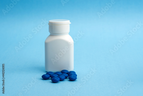blank packaging white plastic bottle for medicine or supplement product design mock-up with tablet or pills.