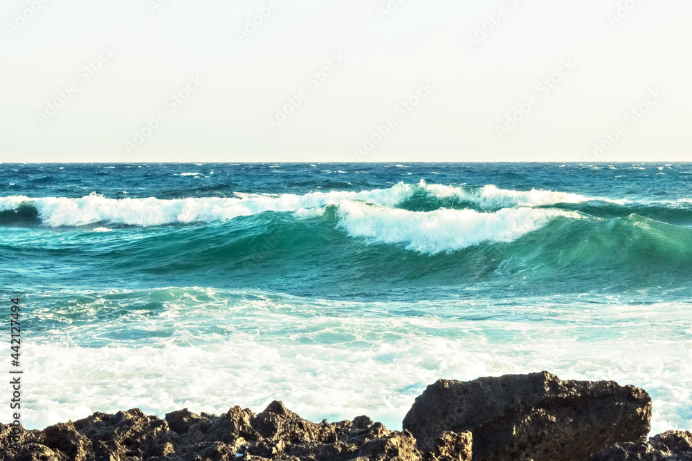 The coast of the Mediterranean Sea. The waves. The horizon. Sky and sea in summer