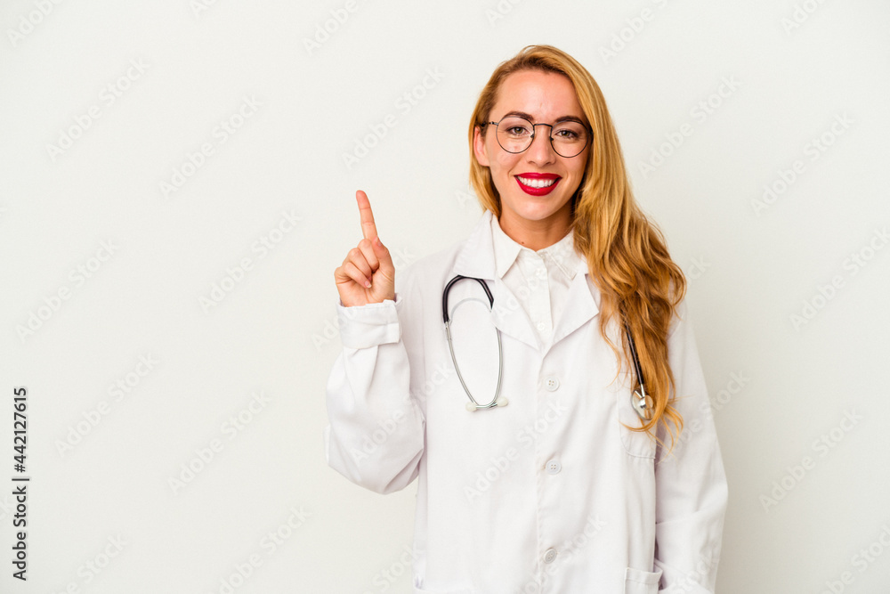 Caucasian doctor woman isolated on white background showing number one with finger. Caucasian doctor woman isolated on white background showing number one with finger.
