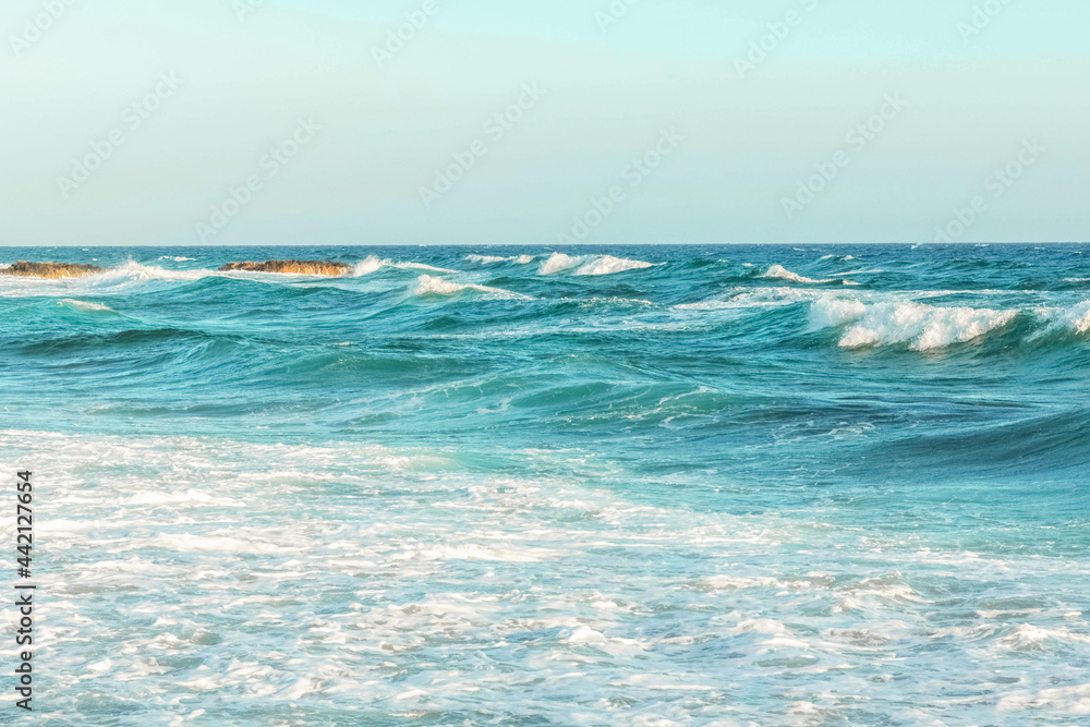 Obraz premium The coast of the Mediterranean Sea. The waves. The horizon. Sky and sea in summer