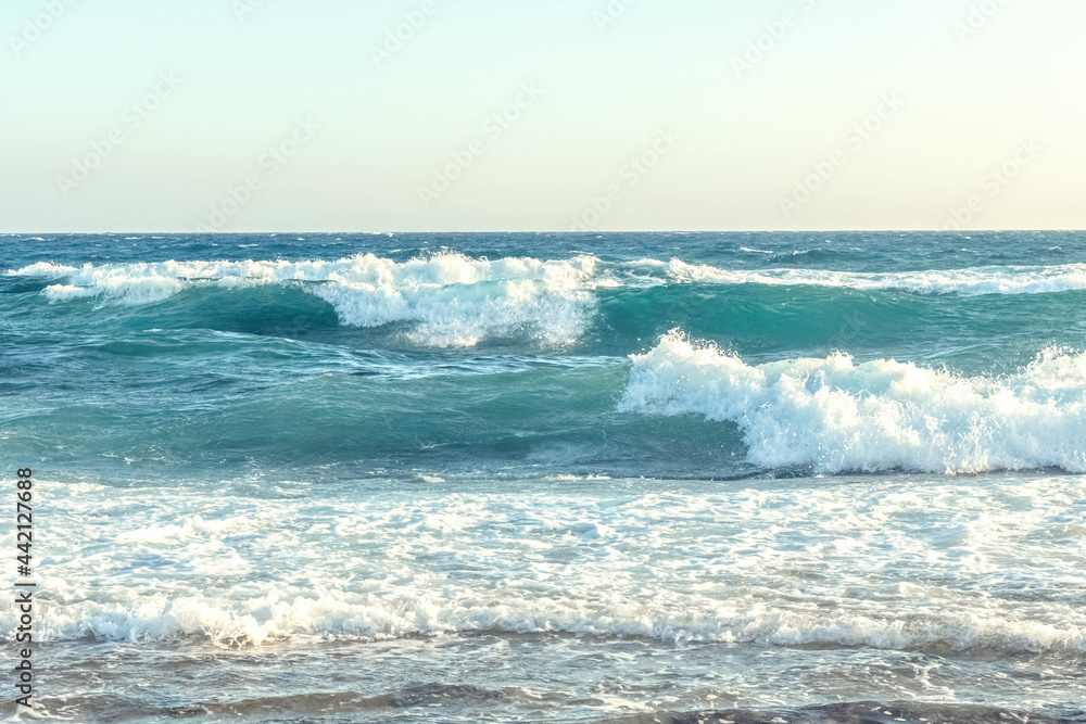 The coast of the Mediterranean Sea. The waves. The horizon. Sky and sea in summer