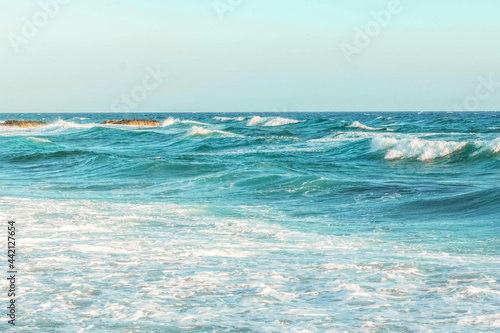 Fototapeta Naklejka Na Ścianę i Meble -  The coast of the Mediterranean Sea. The waves. The horizon. Sky and sea in summer