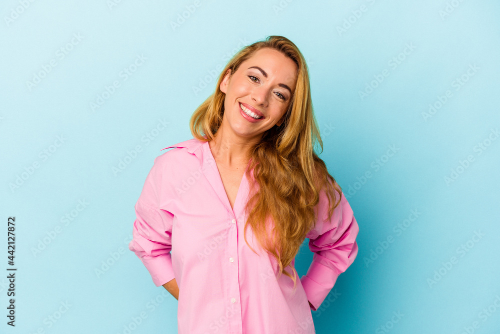 Caucasian woman isolated on blue background happy, smiling and cheerful. Caucasian woman isolated on blue background happy, smiling and cheerful.