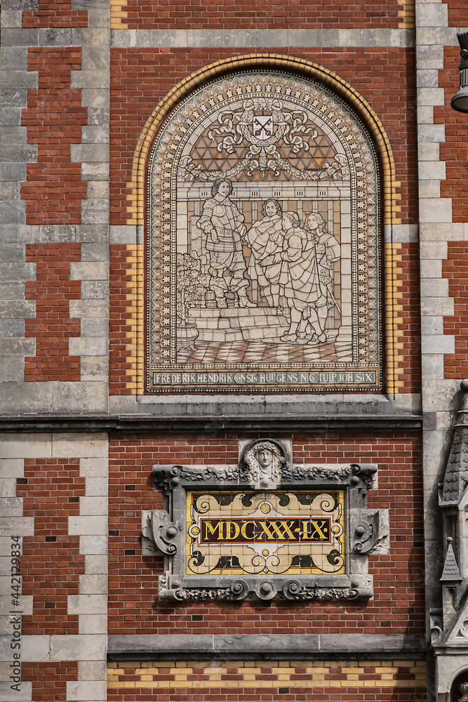 Architectural fragments of famous Rijksmuseum building (1885) in Amsterdam. Amsterdam Rijksmuseum holds many masterpiece paintings of Dutch and world art. Amsterdam, The Netherlands.