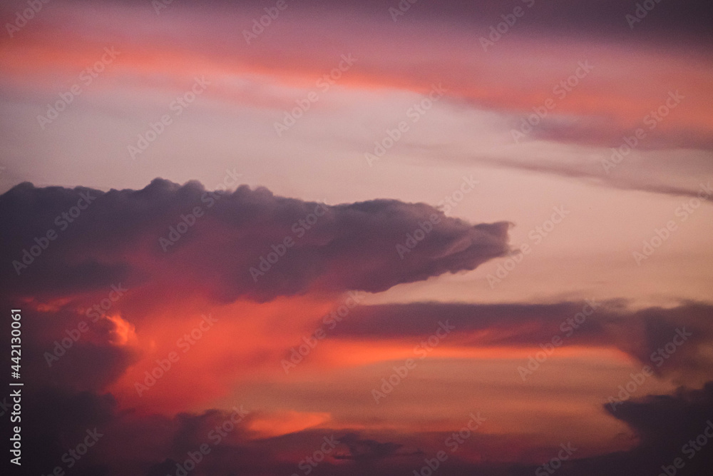 Evening sky sunset.  big puffy cumulus and long stratus clouds. sky background with clouds