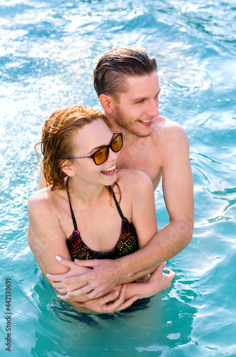 Young couple in the pool