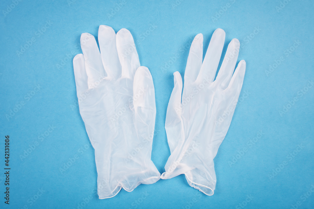 Obraz premium Medical gloves on a blue background. Healthcare medical. top view.