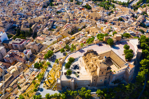 Panoramic aerial view of Caravaca de la Cruz cityscape overlooking medieval fortress and basilica, Murcia, Spain.. photo