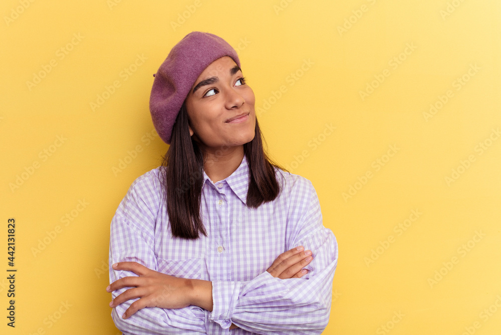 Young mixed race woman isolated on yellow background dreaming of achieving goals and purposes Young mixed race woman isolated on yellow background dreaming of achieving goals and purposes