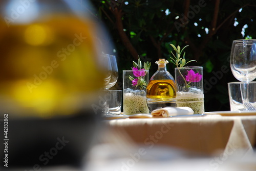 Bottle of extra virgin olive oil in a table